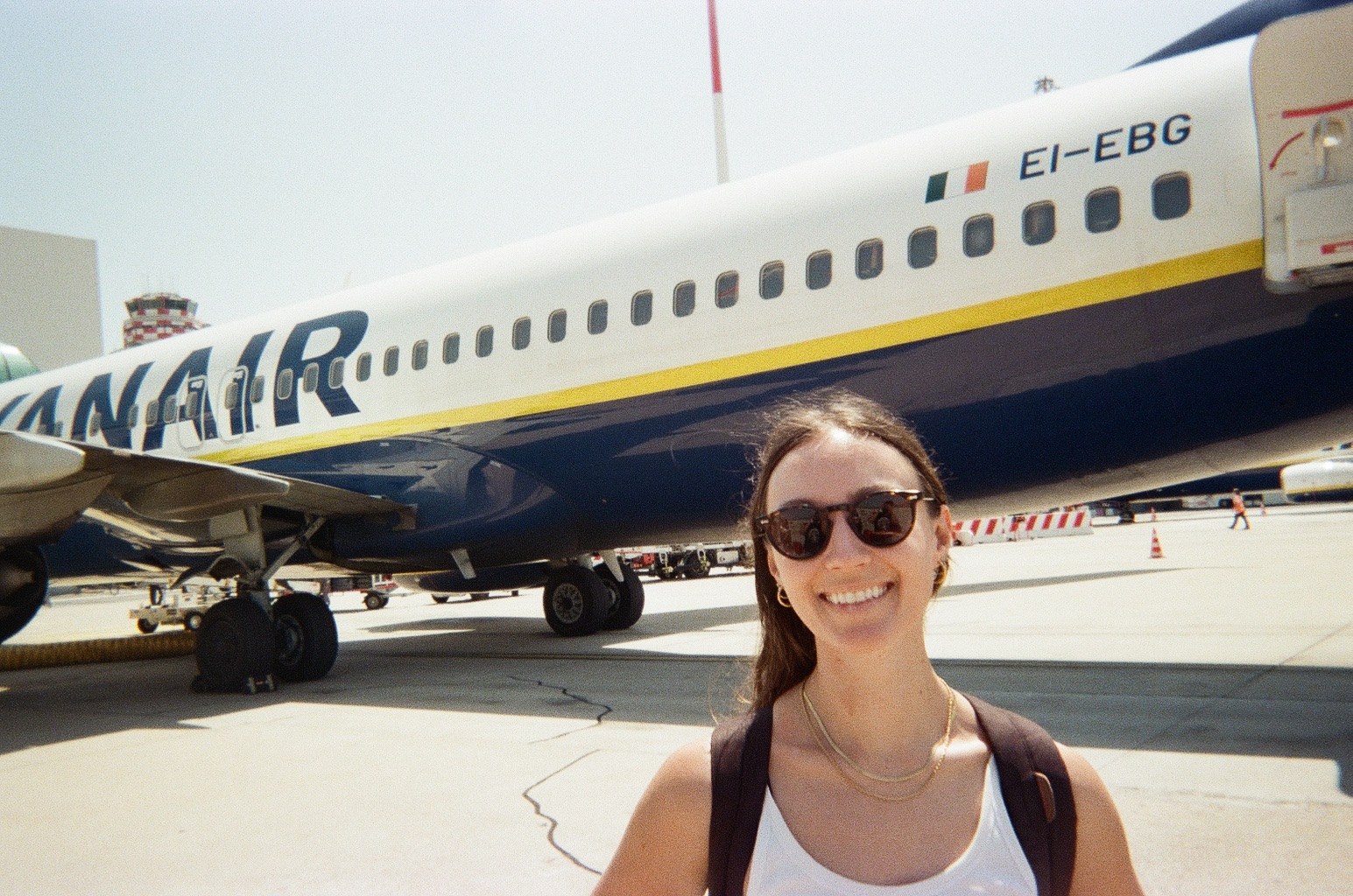 Nicole in front of a Ryanair plane on the tarmac